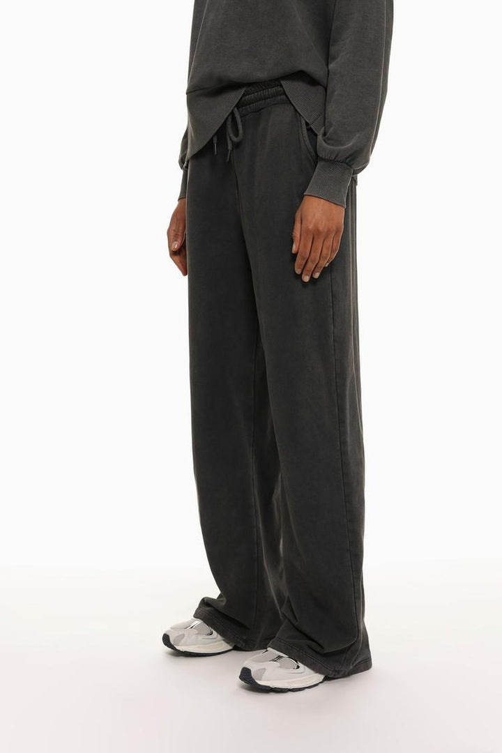 Acid wash plush trousers side view highlighting the soft fabric and comfortable fit.