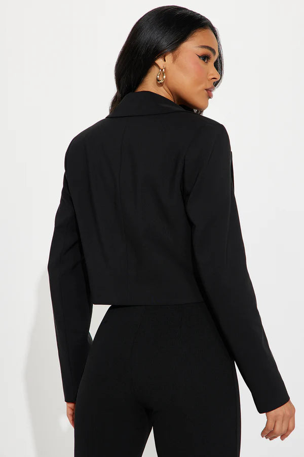 Back view of the Classic Cropped Black Blazer, highlighting its structured design and stylish cut.