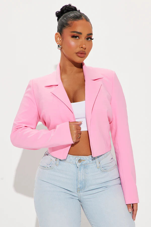 Close-up of the Classic Cropped Blazer in pink, highlighting its fine fabric and detailed stitching.