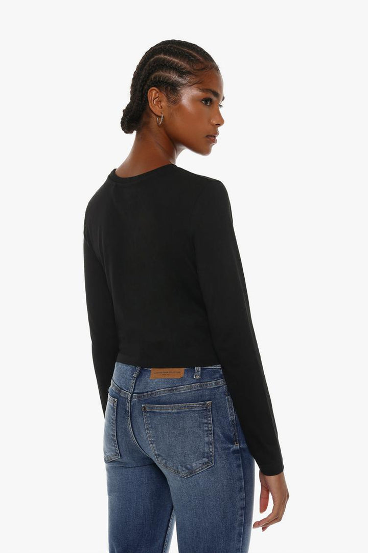 Back view of the black cropped long-sleeve top, showcasing its simple, sleek design with long sleeves and a cropped fit for a clean and modern silhouette.