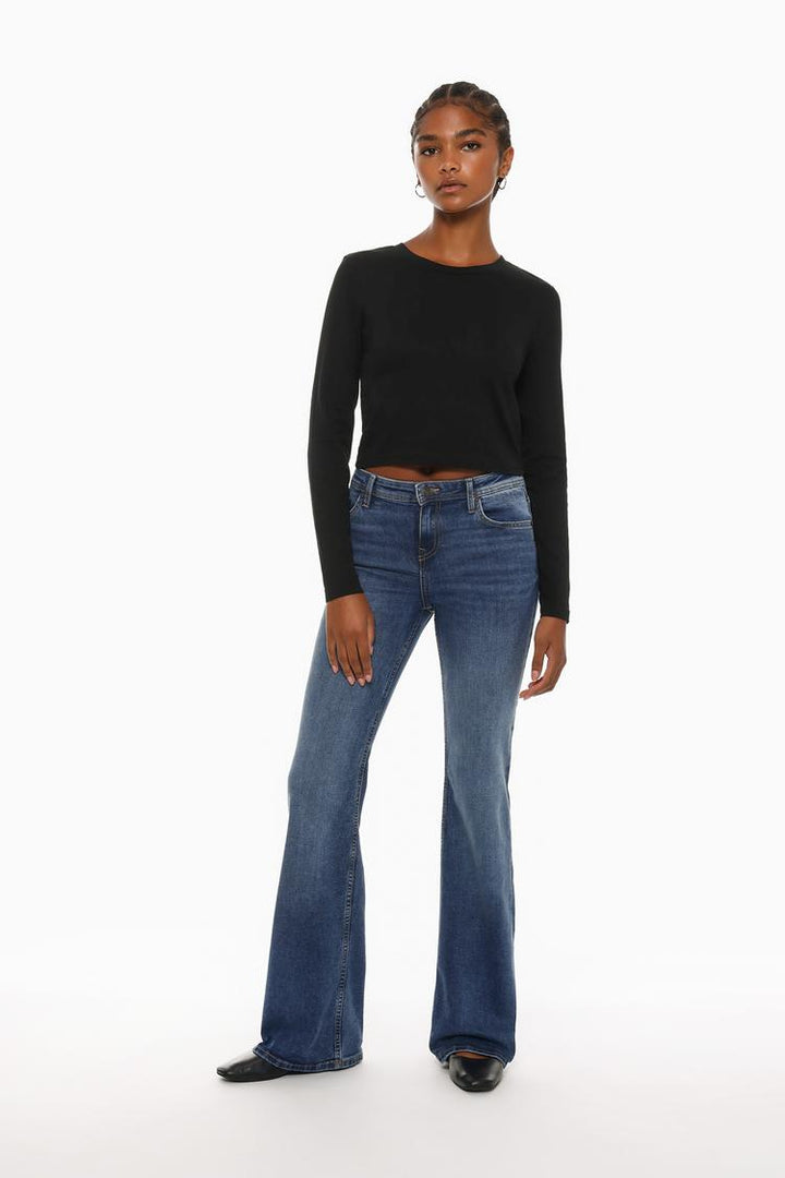 Full-body view of the black cropped long-sleeve top, showcasing its sleek design with long sleeves and a flattering cropped fit, perfect for a casual yet stylish outfit.