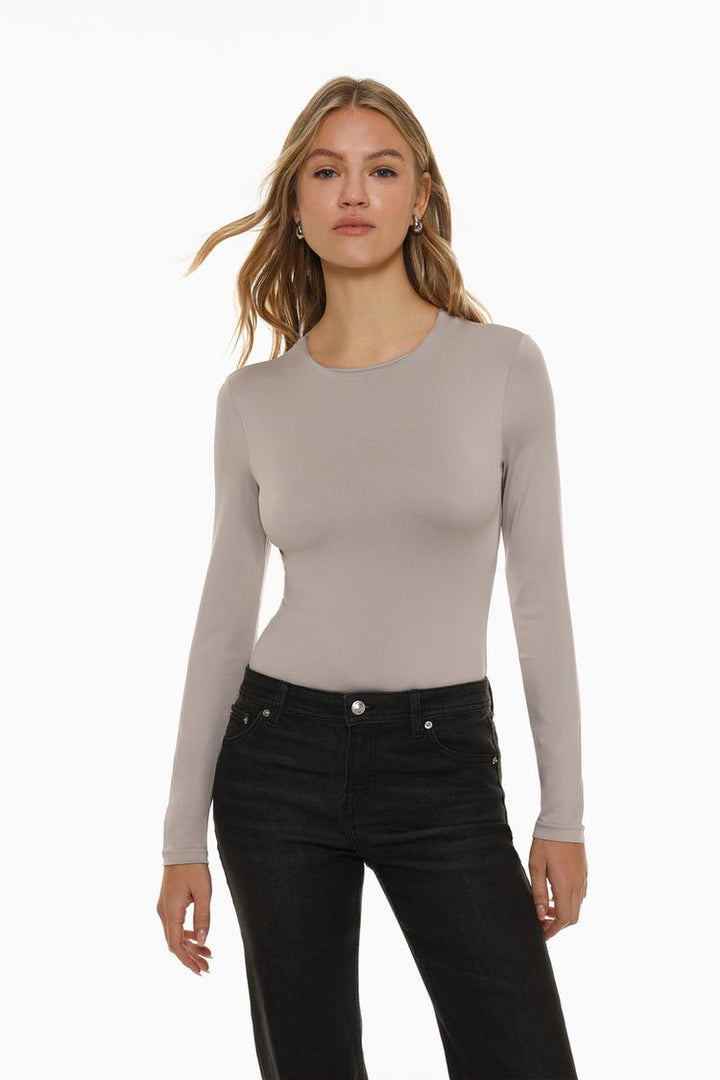 A sleek grey bodysuit made from soft, stretchy polyamide fabric, featuring a classic round neck for a flattering, versatile fit. Perfect for layering or wearing on its own.