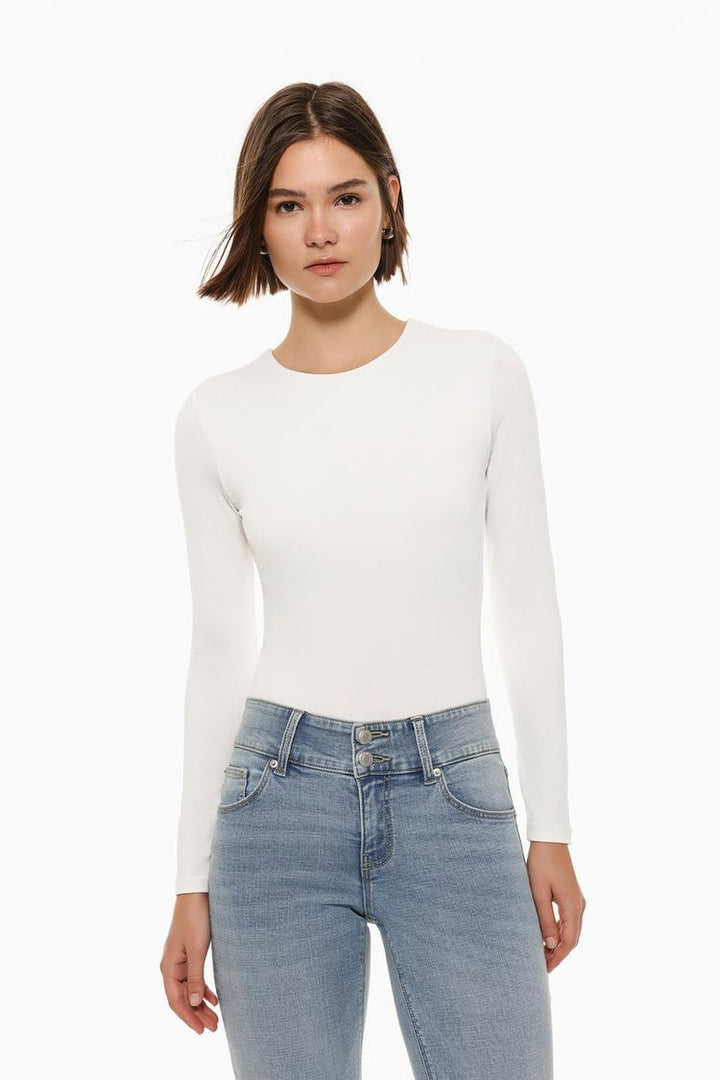 A sleek white bodysuit made from soft, stretchy polyamide fabric, featuring a classic round neck for a flattering, versatile fit. Perfect for layering or wearing on its own.