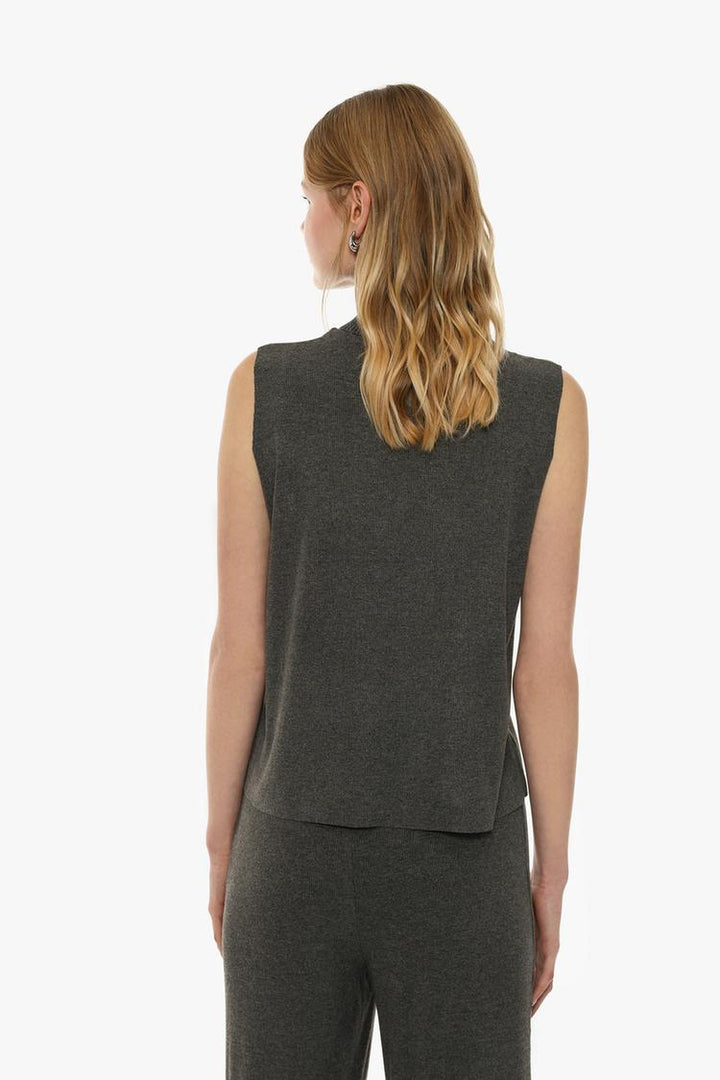 Back view of the grey soft-touch vest sweater, highlighting its clean, minimalist design and comfortable fit, ideal for both layering and wearing on its own for a chic, relaxed look.