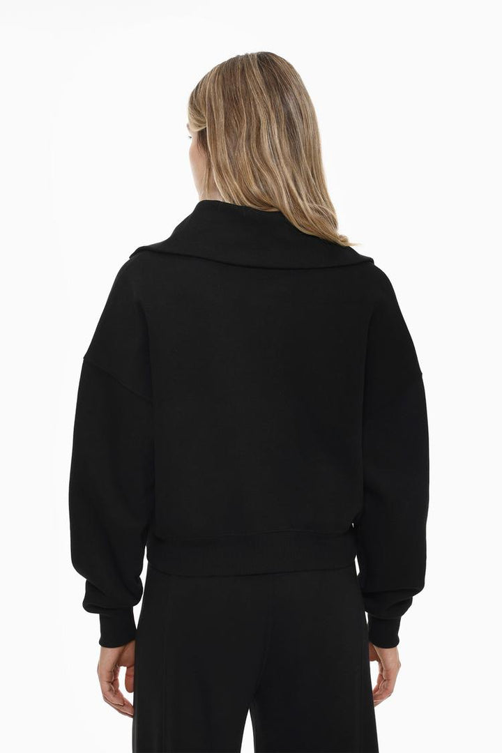 Back view of a women's black sweatshirt with a zip-up collar, featuring a clean, simple design and a comfortable fit.