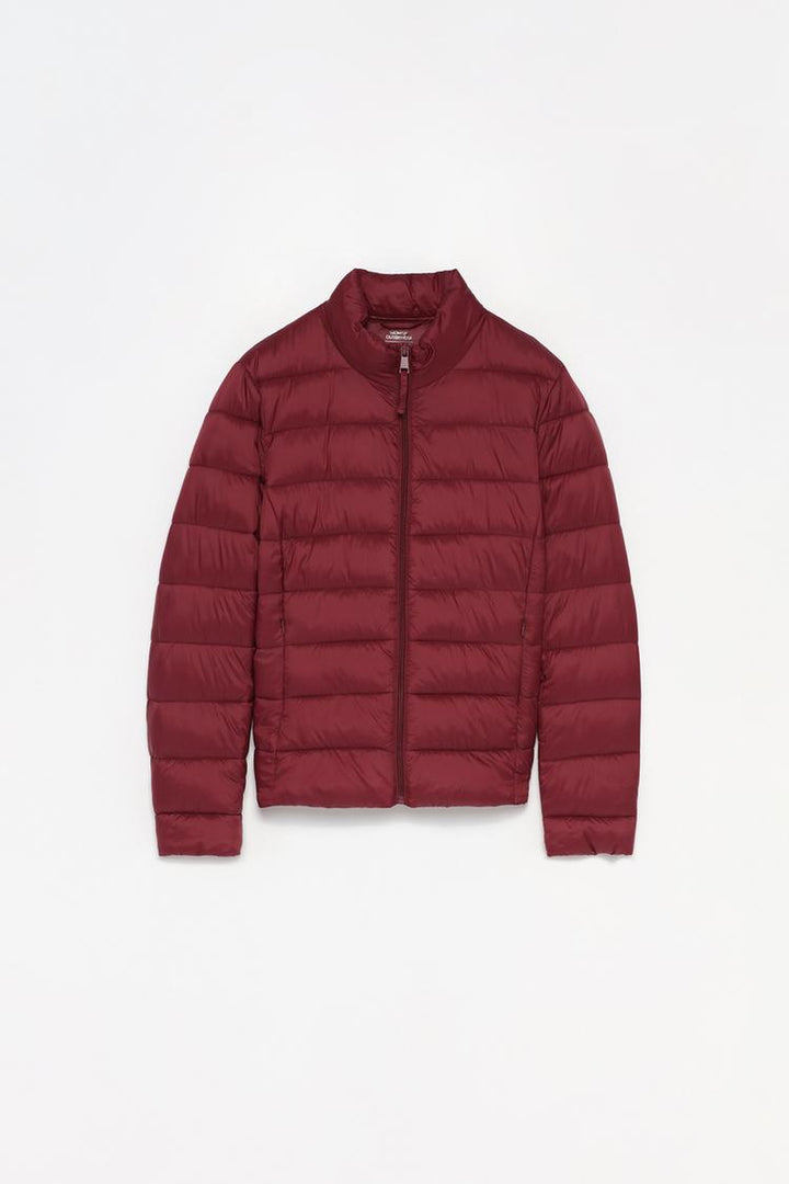 "Basic lightweight puffer jacket in vibrant red, displayed as a standalone product, emphasizing its sleek and versatile design.