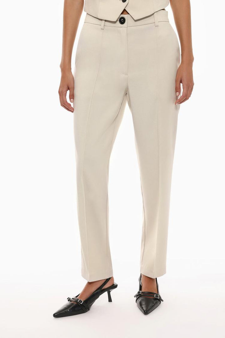 Front view of beige basic smart trousers, designed for a clean and sophisticated appearance