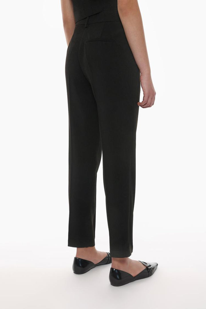 Black basic smart trousers, body display highlighting versatility and professional appeal