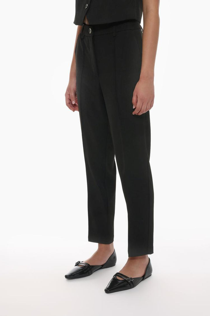 Front view of black basic smart trousers, designed for a sleek and polished look