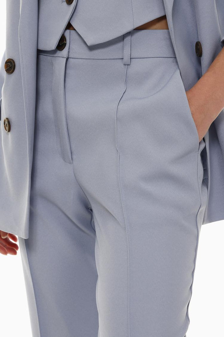 Blue basic smart trousers, body display highlighting a sleek and contemporary silhouette