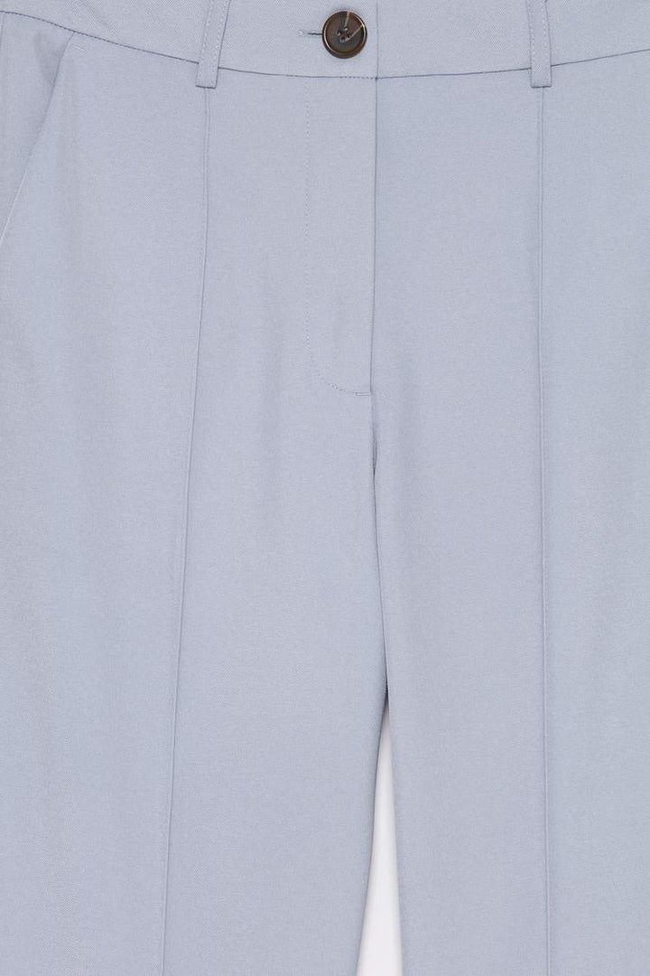 Product display of blue basic smart trousers, perfect for pairing with formal and casual outfits