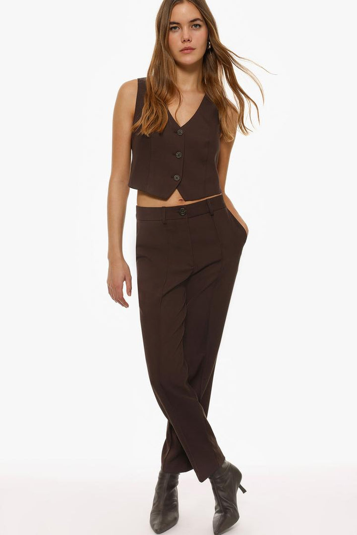 Detailed product display of brown basic smart trousers for versatile styling options