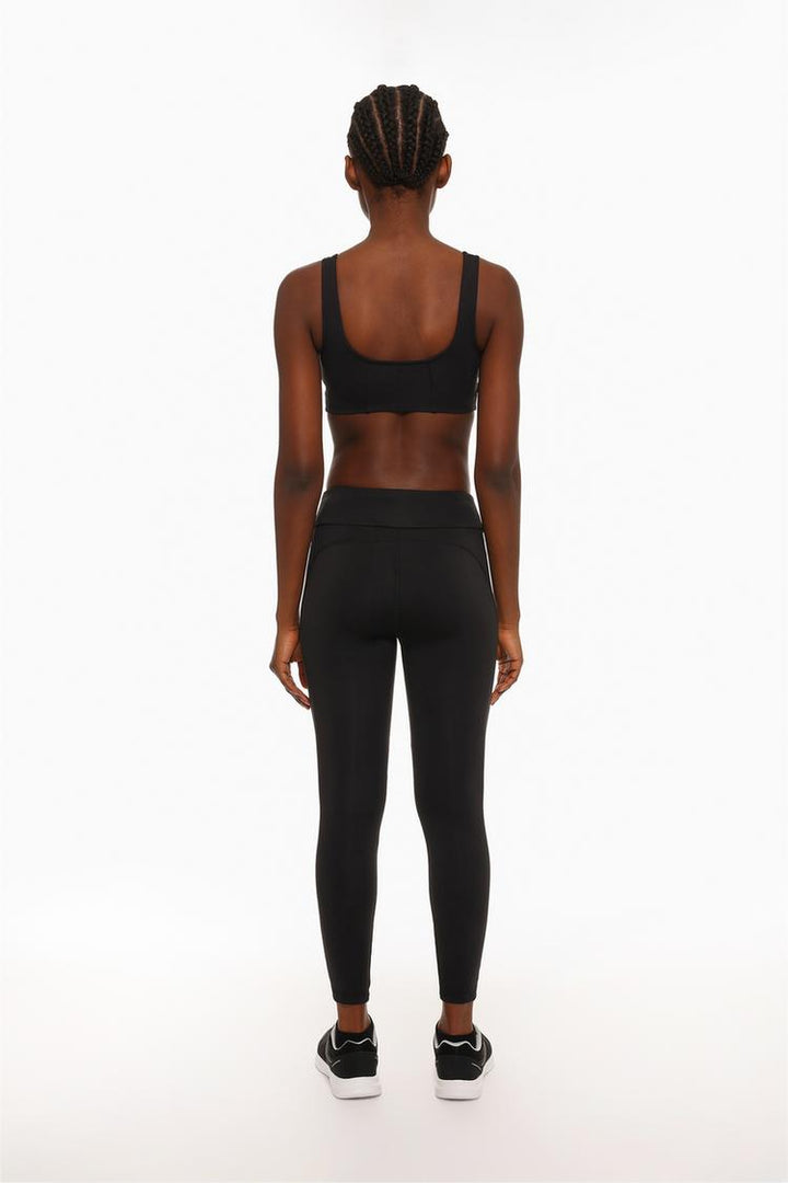 Rear view highlighting the tailored fit and supportive waistband.