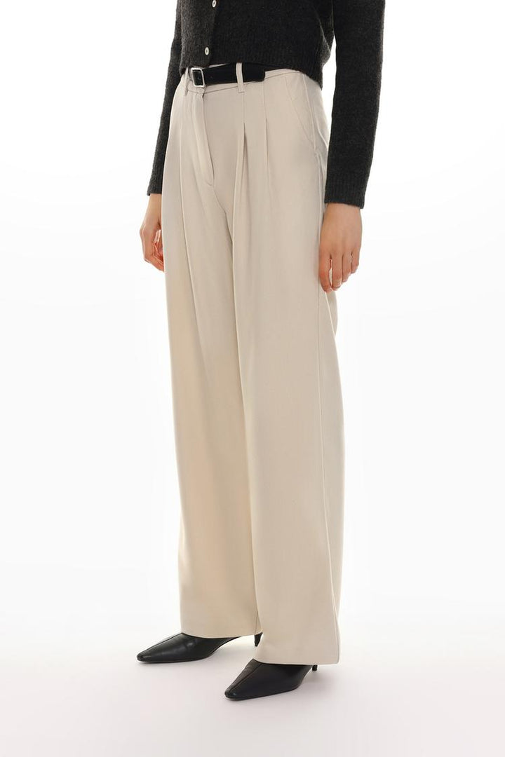 Front view of beige belted wide-leg trousers, perfect for versatile, chic styling