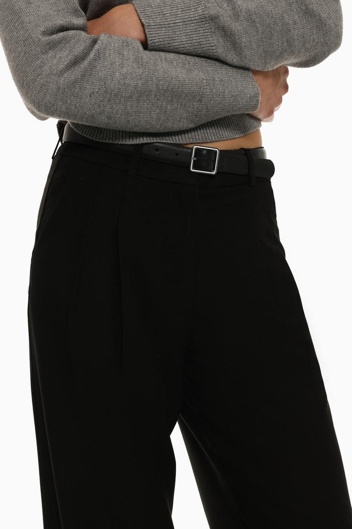 Body view of black belted wide-leg trousers, combining elegance and versatility