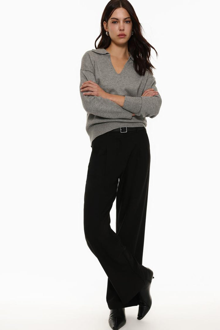 Full-body shot of black belted wide-leg trousers, perfect for day-to-night transitions