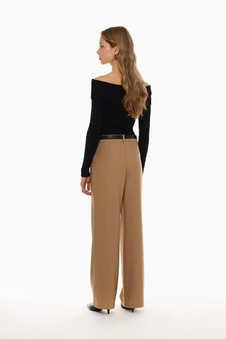 Back view of bronze belted wide-leg trousers, showcasing rich color and fine stitching