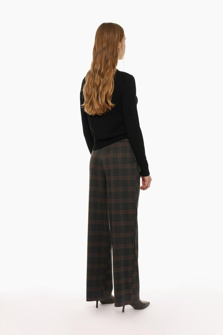 Front view of grey belted wide-leg trousers, emphasizing a classic, versatile fit