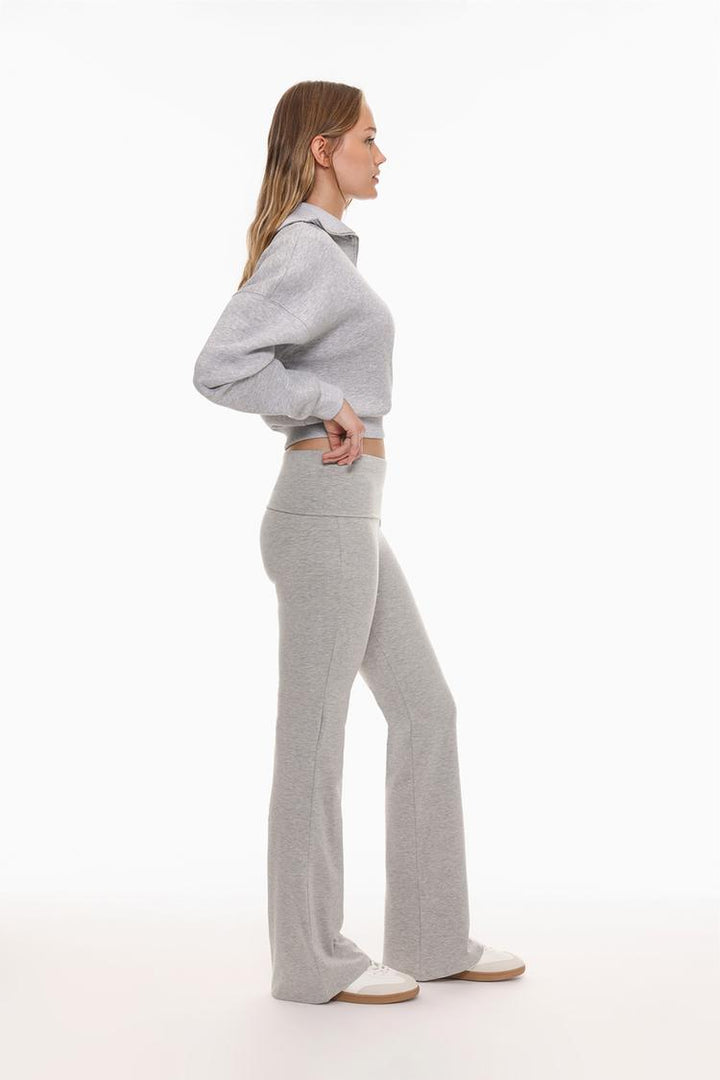 Side profile shot highlighting the smooth, streamlined fit and the unique fold-over waist.