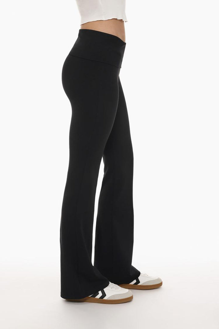 Close-up of the leggings, highlighting the fold-over waist and soft fabric texture.