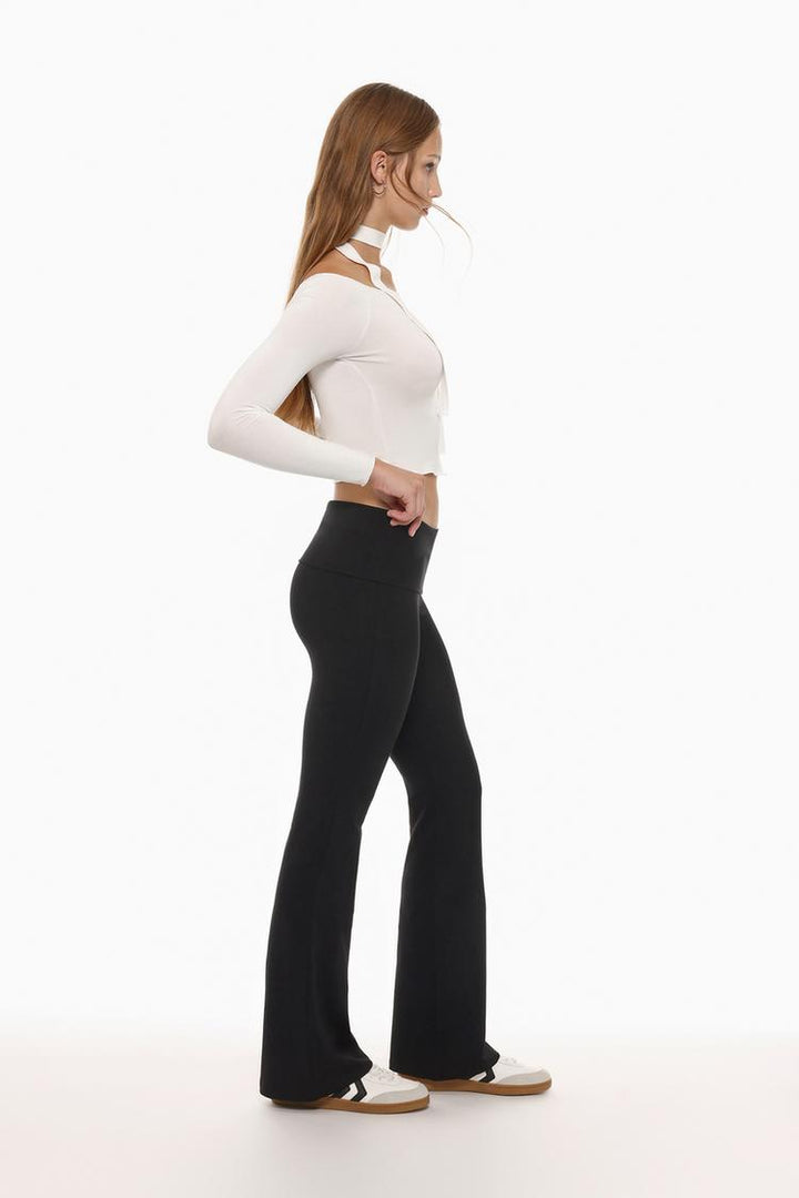 Side profile showing the smooth, contoured fit and the fold-over waistband.