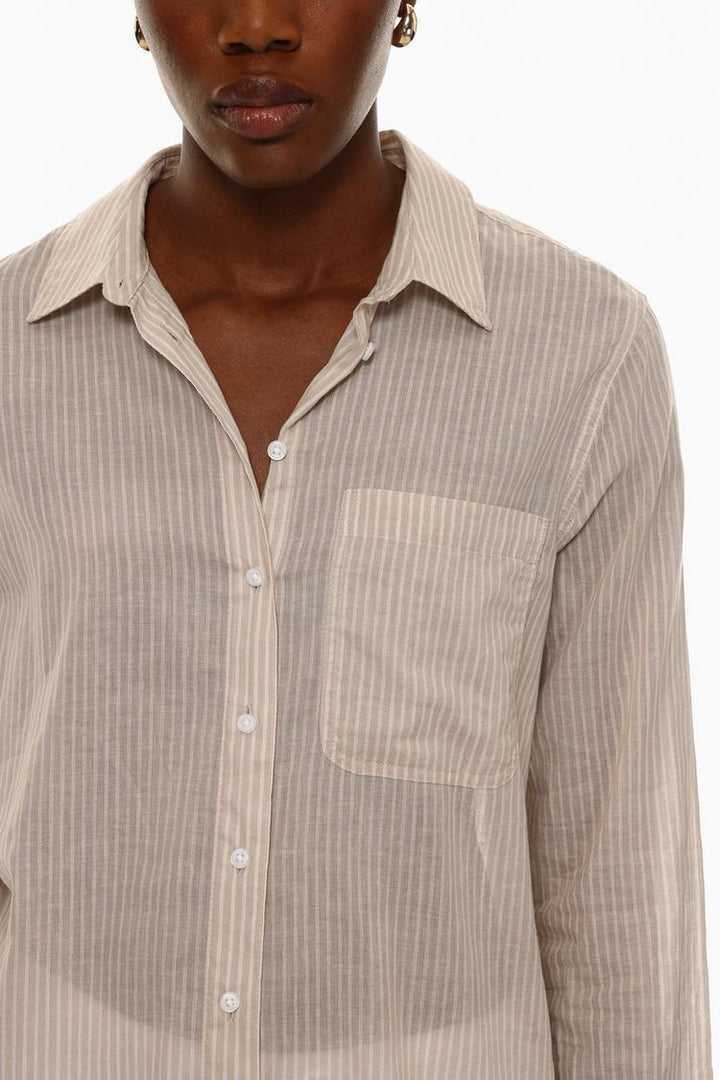 Cotton shirt beige front view showcasing its relaxed fit and smooth fabric texture.