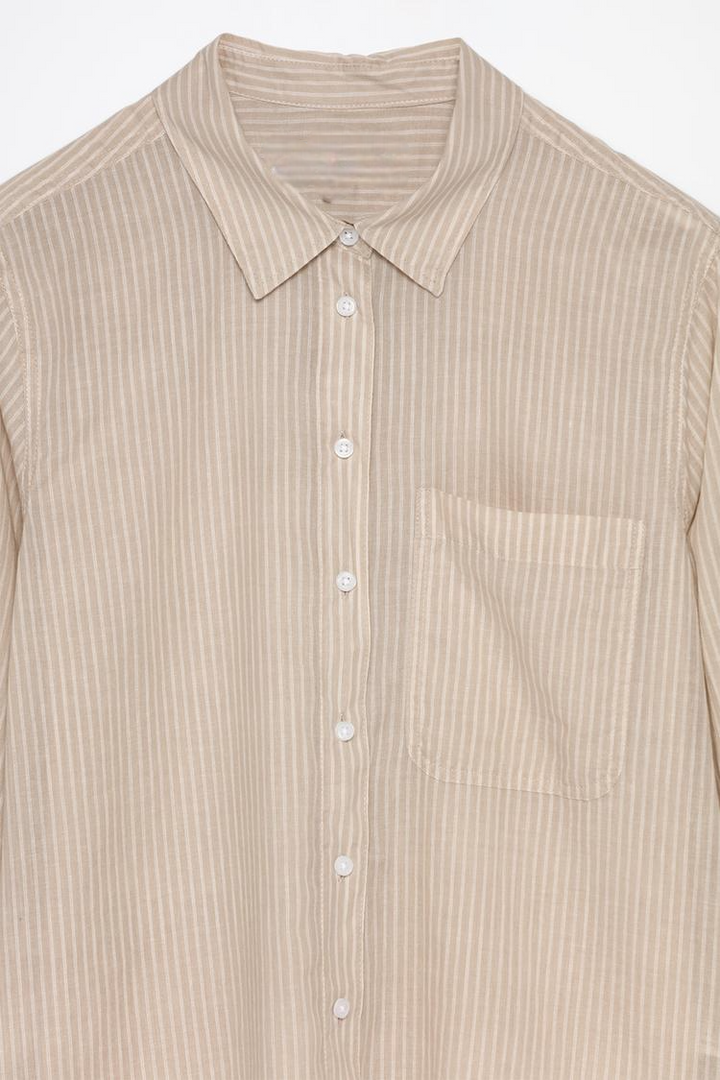 Cotton shirt beige product shot showcasing its soft fabric and clean design.