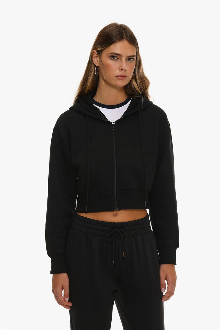 Women's black cropped jacket, offering a sleek, modern design with a cropped length, perfect for layering and adding a stylish touch to casual outfits.