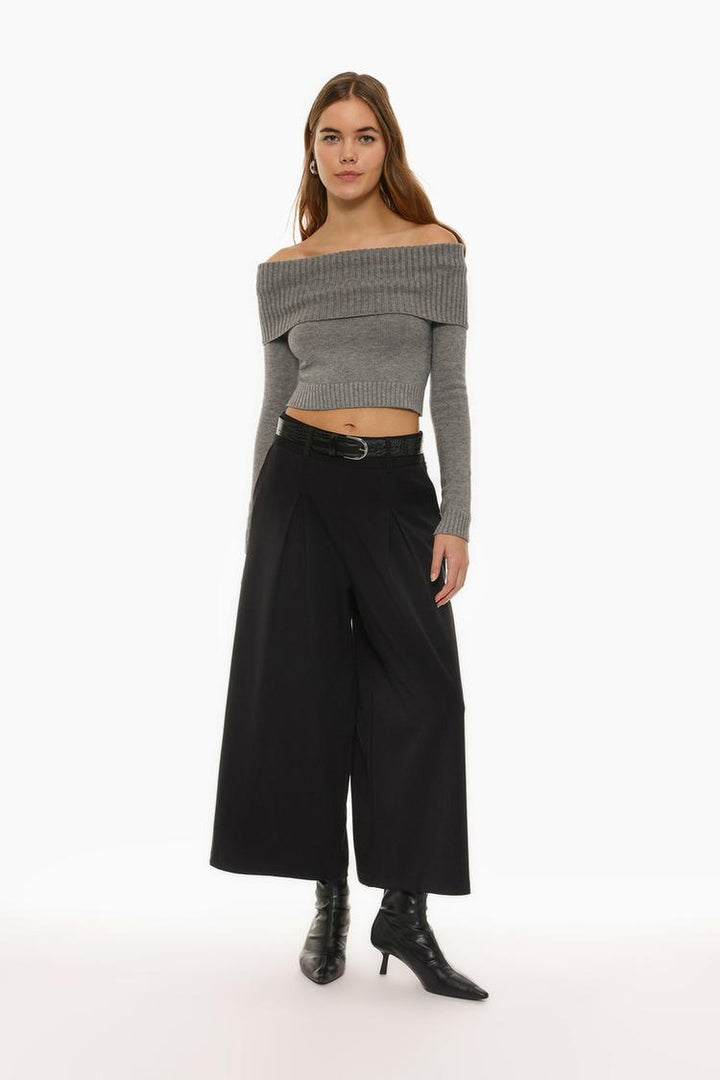 Black culottes, highlighting their flowing and contemporary design