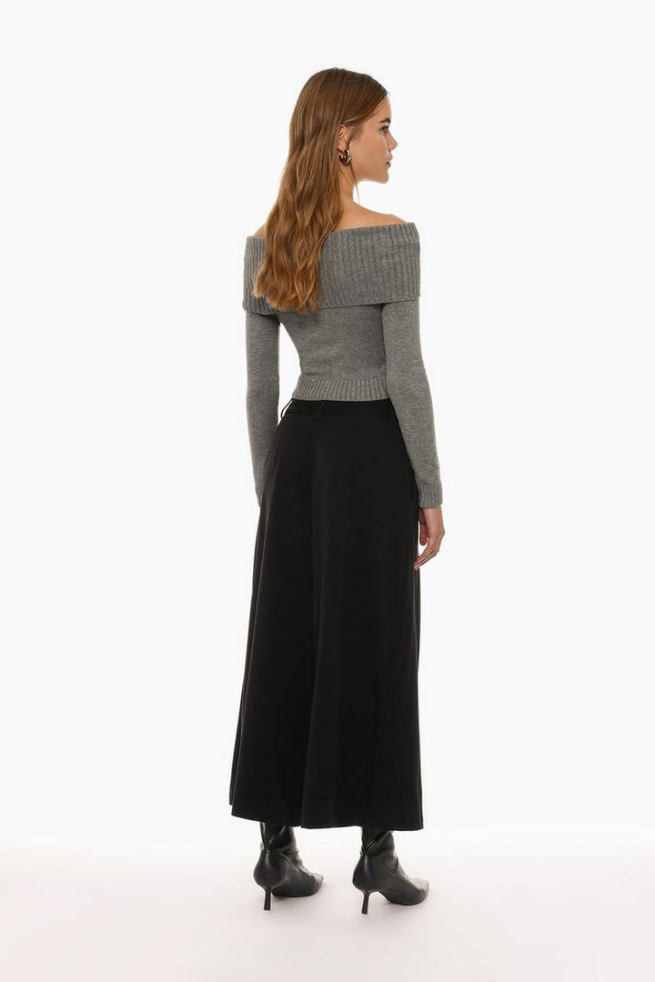 Back view of black culottes, revealing the seamless tailoring and refined look