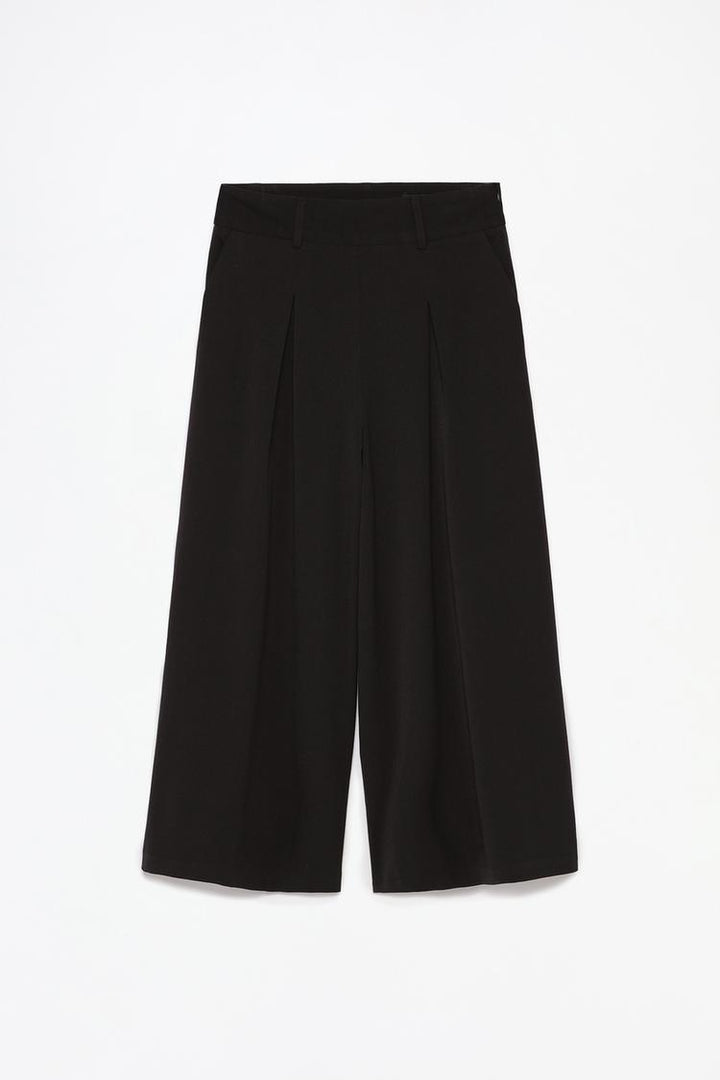 Full-product shot of black culottes, displaying their versatile and minimalistic appeal