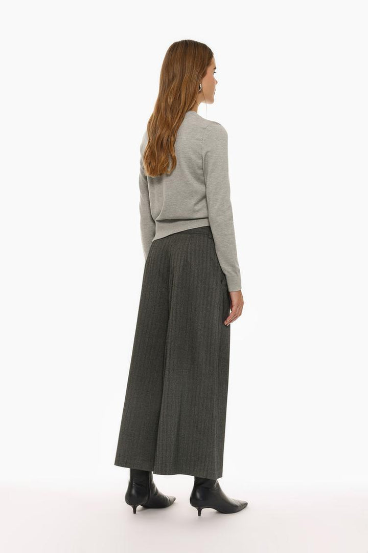 Back view of grey culottes, featuring clean and polished tailoring
