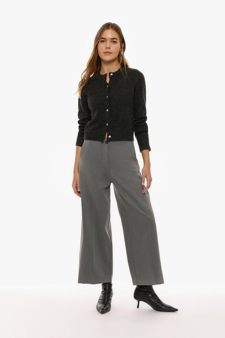 Grey culottes without a defined waistband, designed for understated sophistication and comfort.