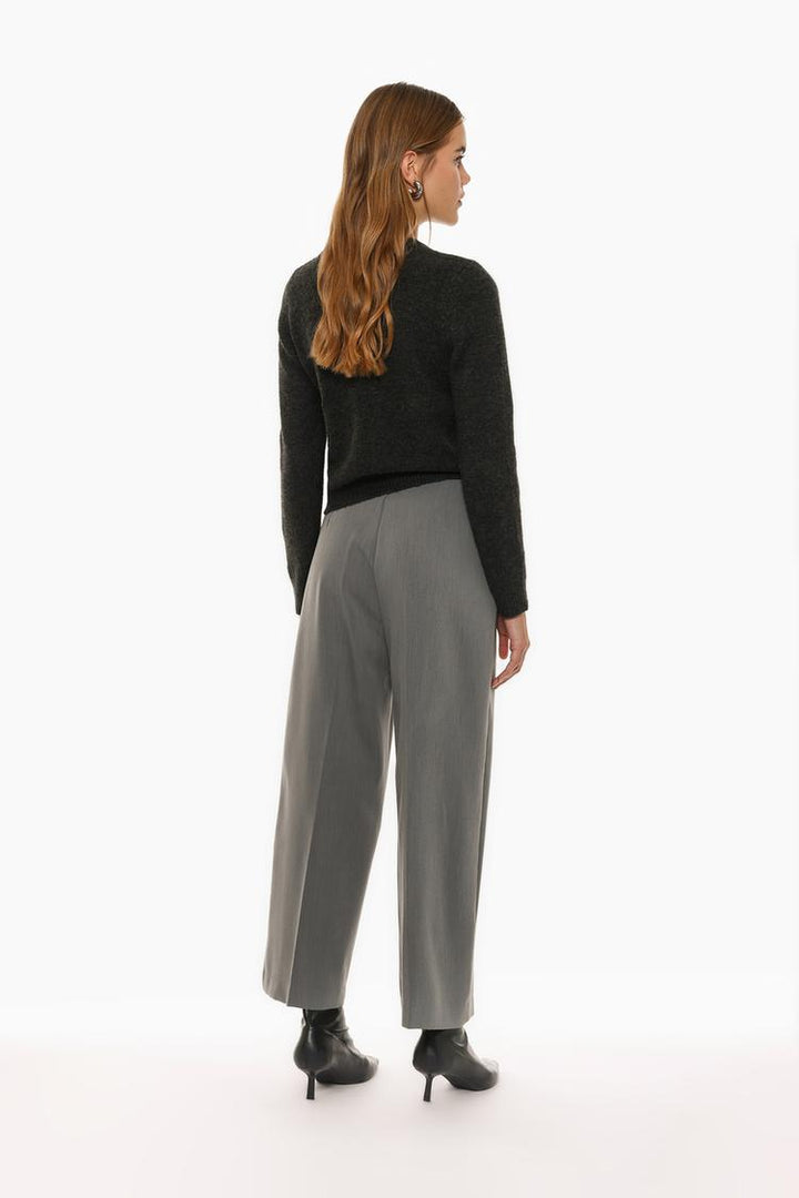 Back view of grey culottes without a waistband, showcasing the smooth tailoring and contemporary fit.