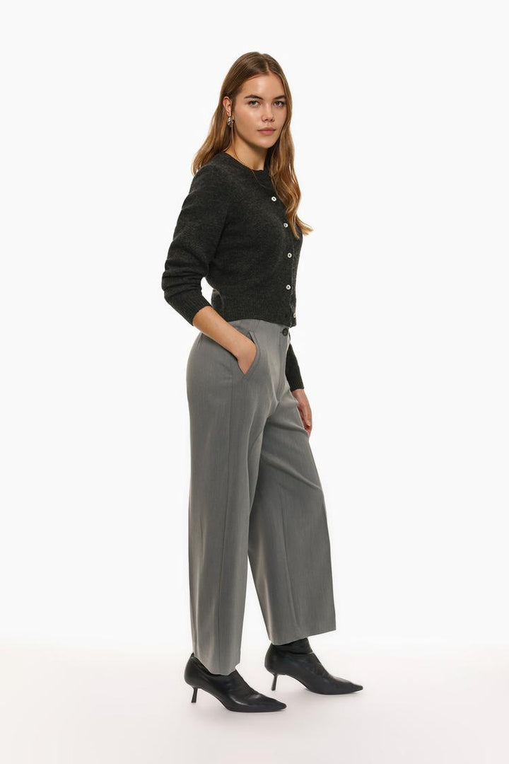 Full-product image of grey culottes without a waistband, featuring their timeless appeal and neutral tone.