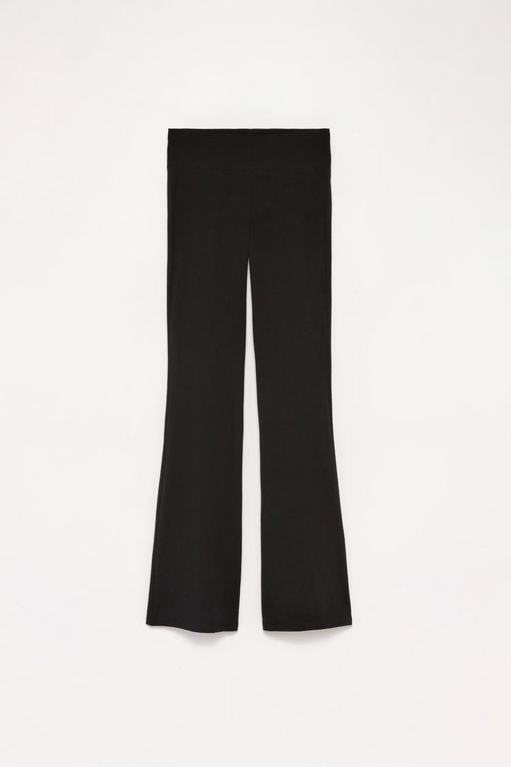 Product shot of the black flared leggings with ribbed waistband, designed for a chic and comfortable look.