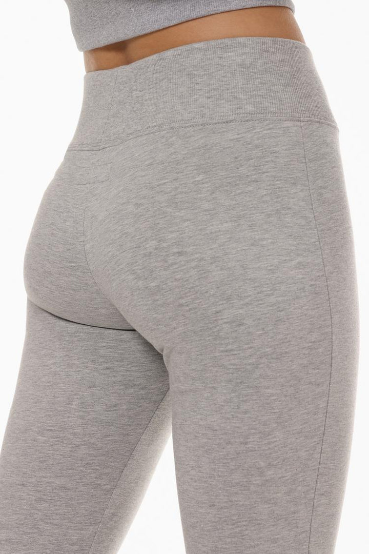 Back view of the grey leggings, showcasing the seamless design and flattering fit with the ribbed waistband.