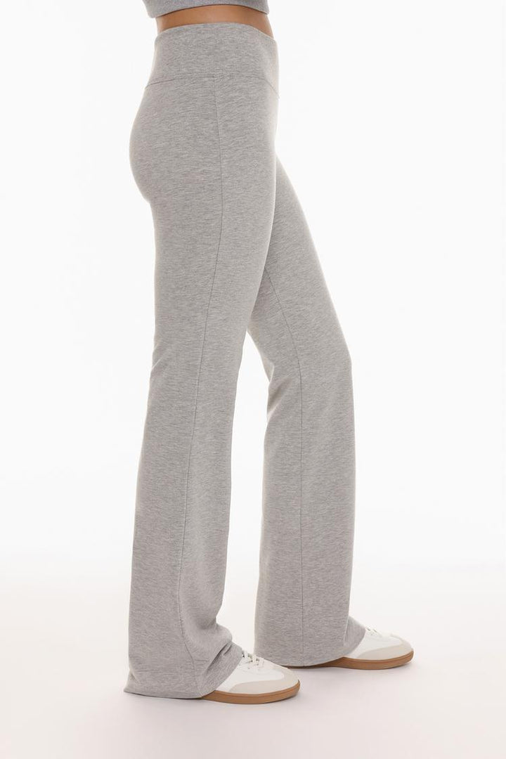 Close-up of the leggings showing the textured ribbed waistband and soft fabric, designed for a comfortable fit.