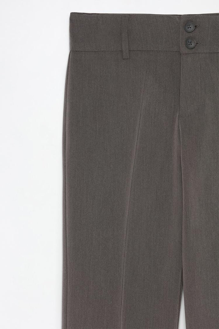 Back view of trendy grey flared trousers, showing tailored stitching and fit details