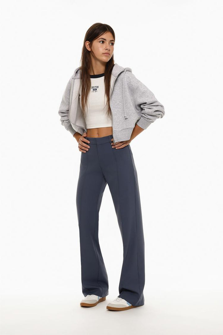 Image showcasing the flared trousers with pleats in blue, highlighting the stylish and flattering pleat design along with the flared fit.