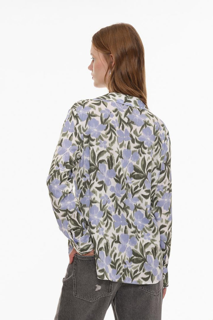 Flowing Henley shirt back view showcasing a loose, comfortable fit and a simple design.