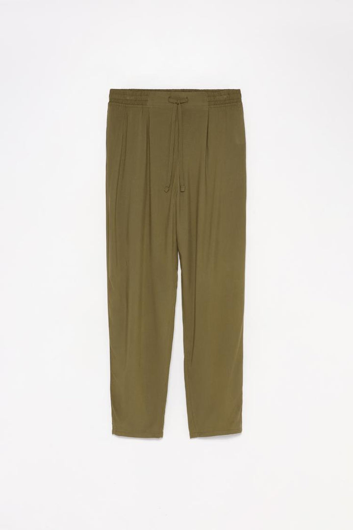 Full product image of the flowing green joggers, showing the complete design and fabric texture.