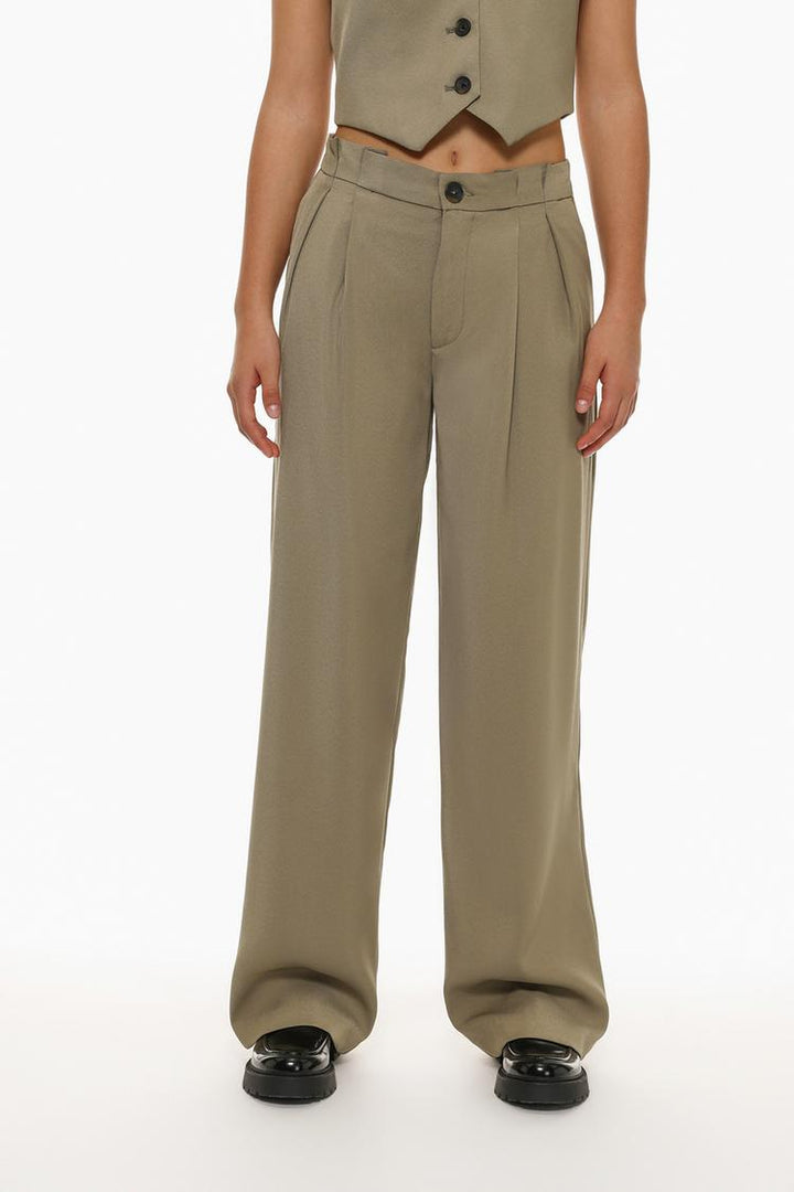 Back view of beige formal wide-leg trousers, emphasizing refined tailoring