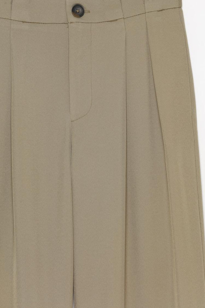 Detailed product display of beige formal wide-leg trousers, crafted for lasting appeal