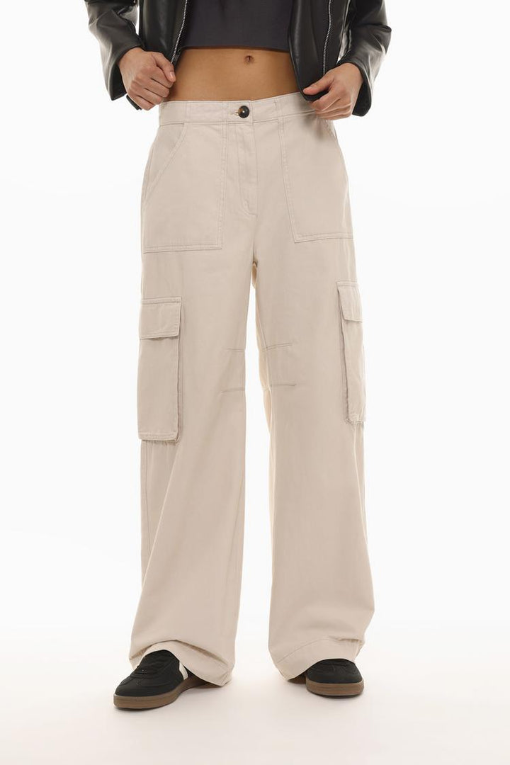 Front view of the beige cargo trousers, highlighting their casual fit and utilitarian style.