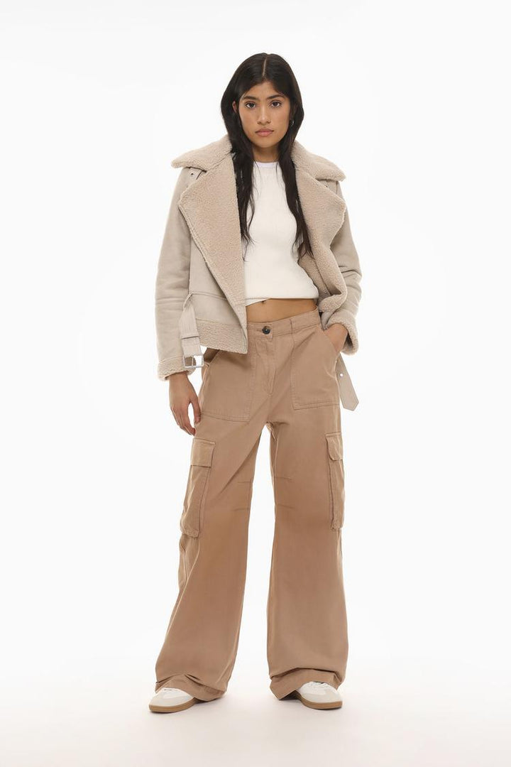 Full-body outfit styled with the brown cargo trousers, ideal for a modern, earthy wardrobe.