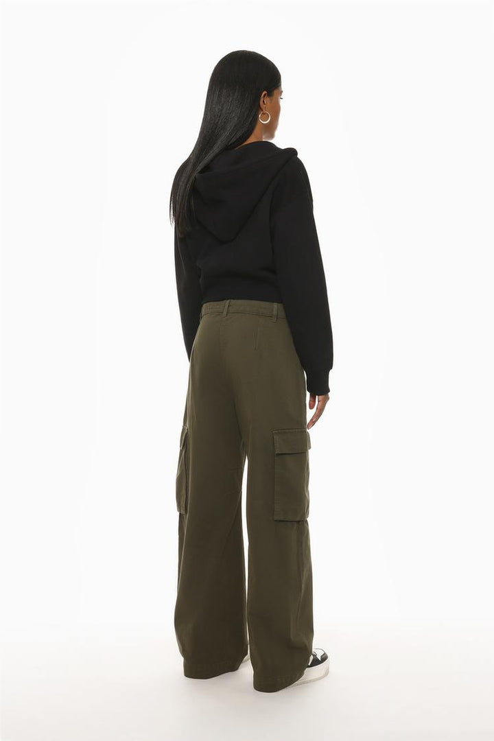 Rear view of the dark green trousers, highlighting the robust pocket detailing and garment-dye texture.