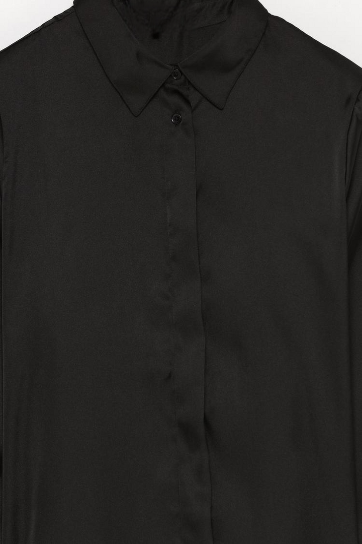 A black long-sleeve satin shirt featuring a sleek, luxurious satin fabric that gives it a smooth, shiny finish. The shirt includes a button-down front, long sleeves, and a comfortable fit, making it a stylish and versatile addition to any wardrobe.