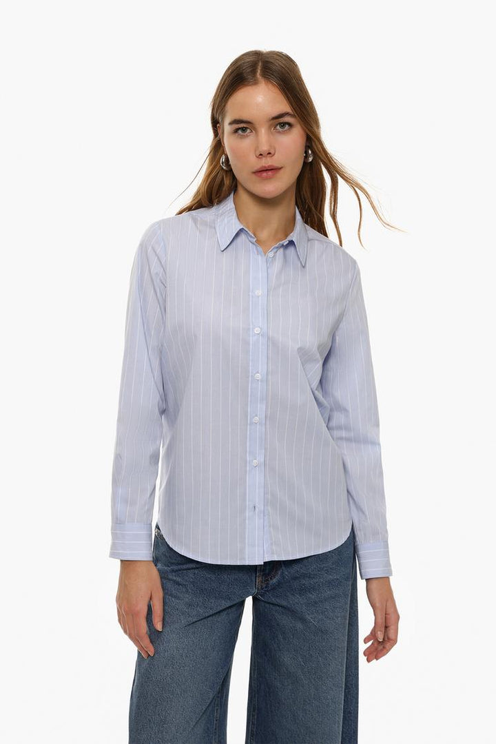 Full-body view of a blue poplin shirt, showcasing its sleek design, structured fit, and classic button-down style, perfect for smart-casual or professional wear.