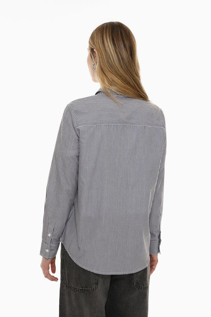 Back view of a grey poplin shirt, showcasing its tailored fit, smooth texture, and clean design.